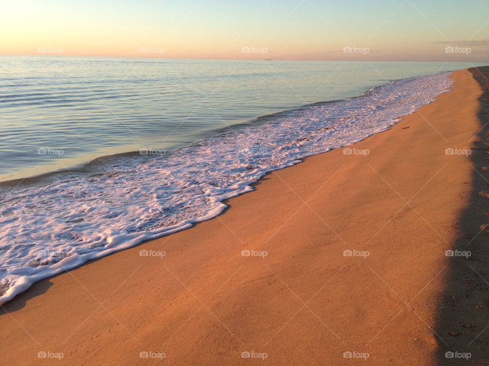 Wave on the sand, evening