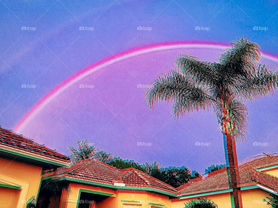 Bright Double Rainbow appears after a long afternoon of thunderstorms in Tampa, Florida. 