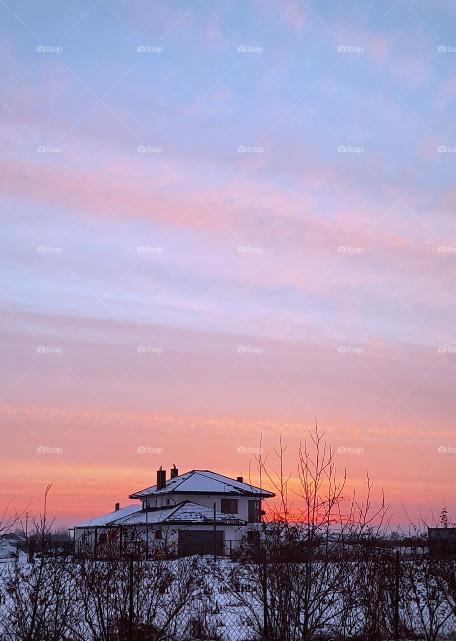 sky just before sunrise with linear clouds