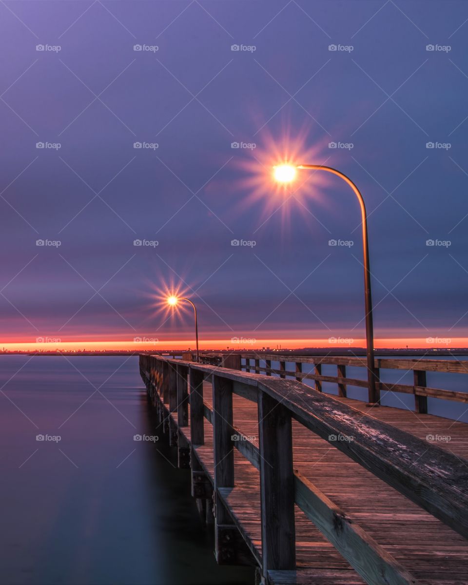 Purple sky after the sunset on an old wooden fishing pier. 