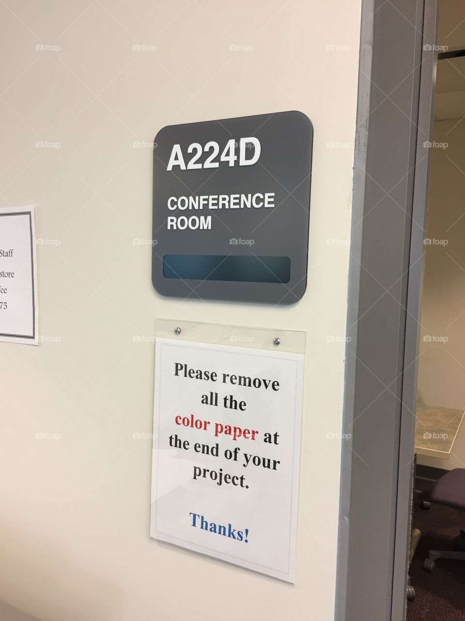 Standard office sign posted at doorway