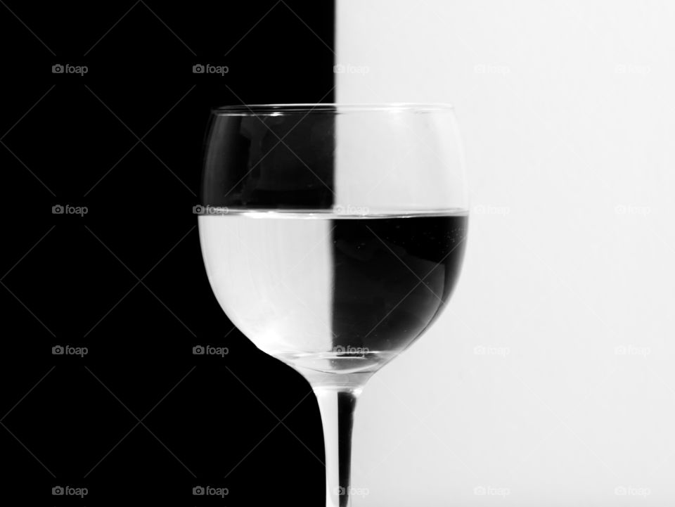 symmetry photo - wine glass with black and white background reflection