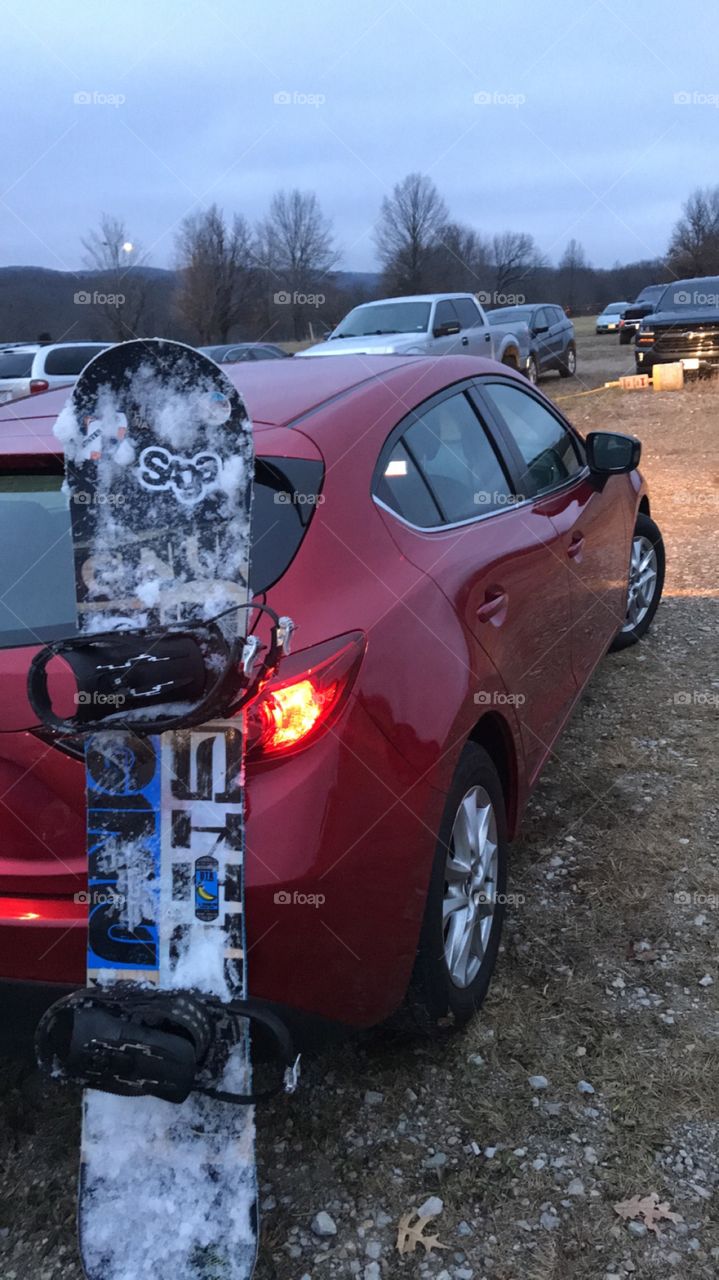 Snowboard + snow + Mazda + Red + devious + sporty