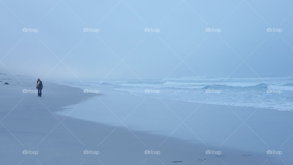 Lone beach walker