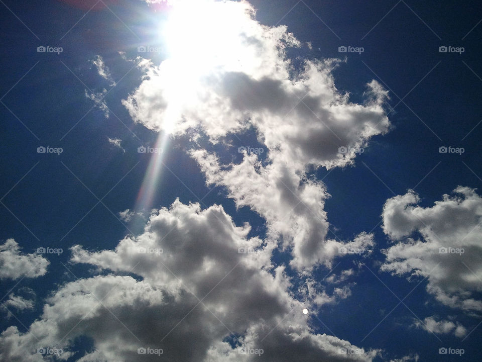 Sun-Lined Clouds. The sun peeking out and shining from behind the clouds