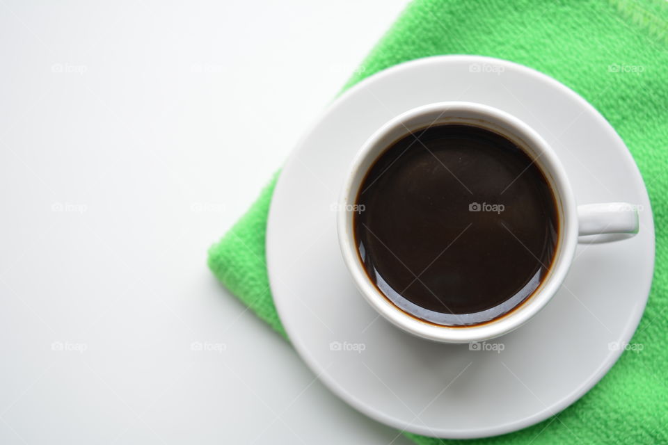 cup of coffee on a white background top view beautiful texture, morning routine