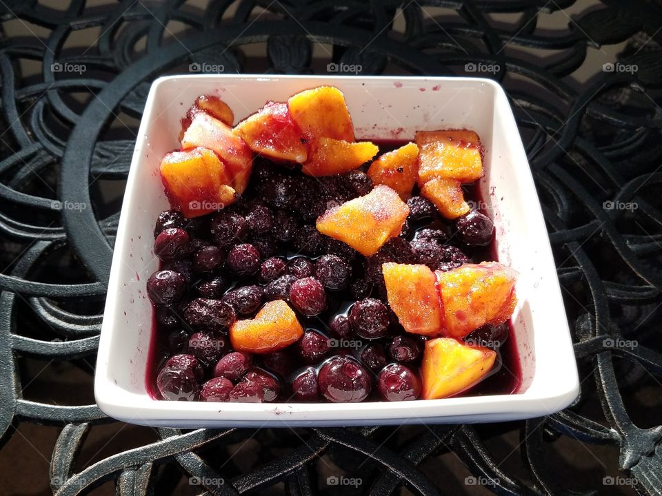 Bowl of mangos and blueberries