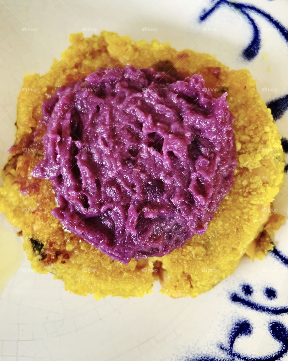 Hummus purple beets on yellow polenta 