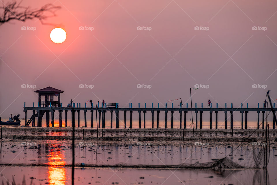 Enjoy on the bridge in sunset moment