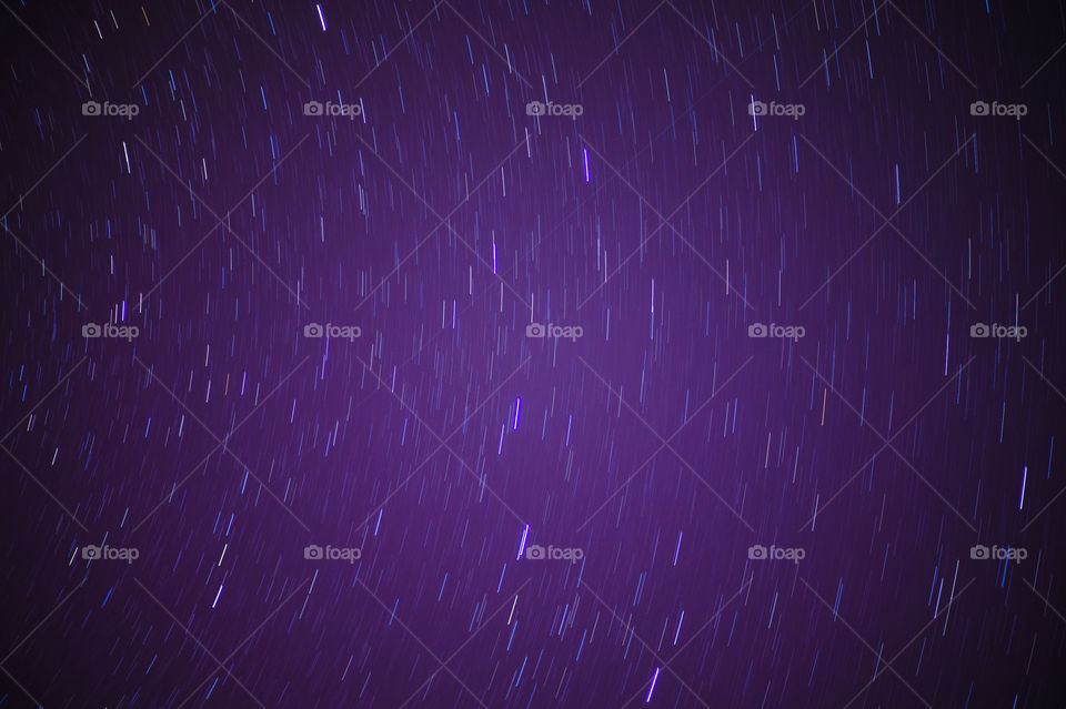 The movement of stars in a clear cloudless sky