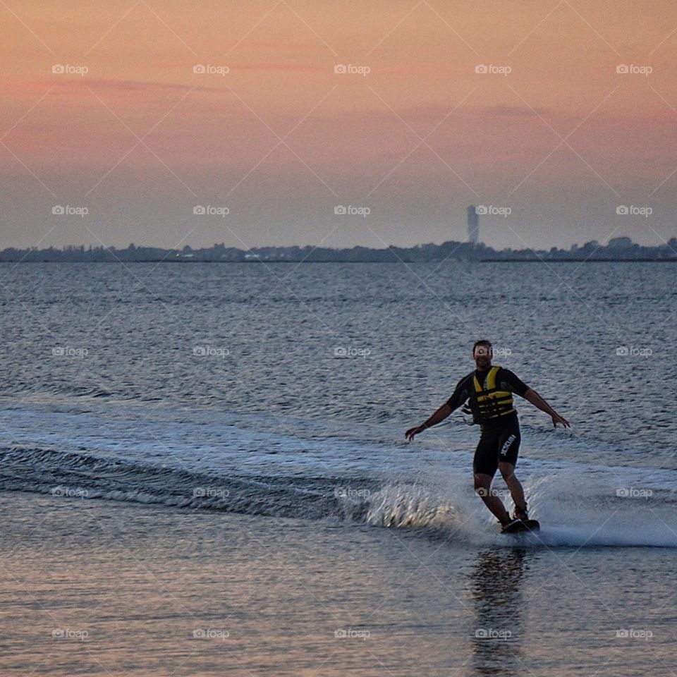 Waterskiing in sunset