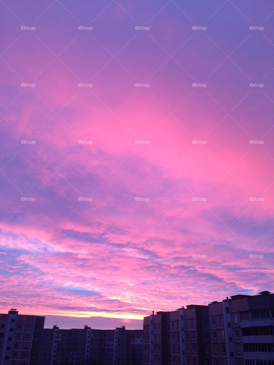 Purple color of the sky and buildings silhouette 