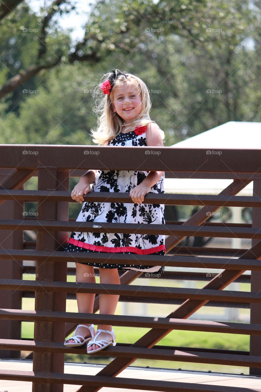 Crossing over the bridge. Girl on a bridge