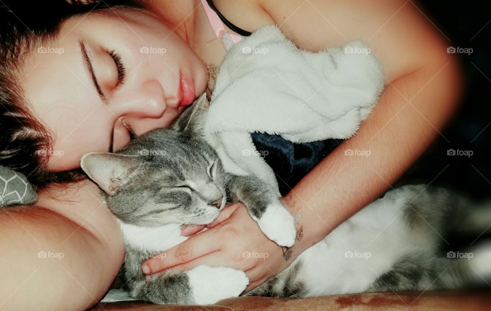 My cat Toby and I taking a cat nap. He loves to cuddle! He sleeps like this every day. 5 years and counting