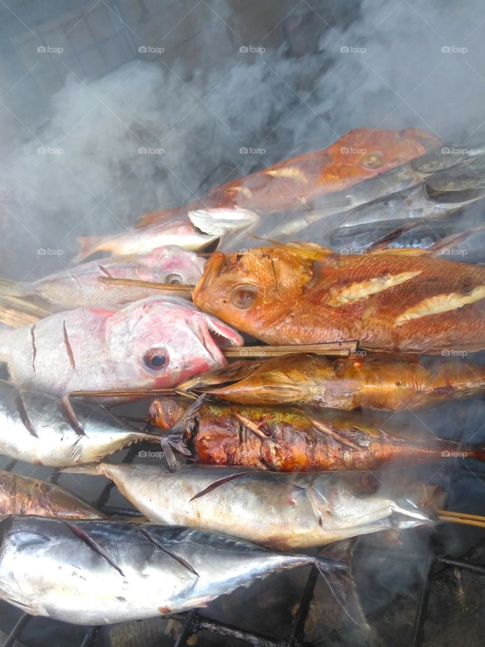 Delicious grilled fish on beach