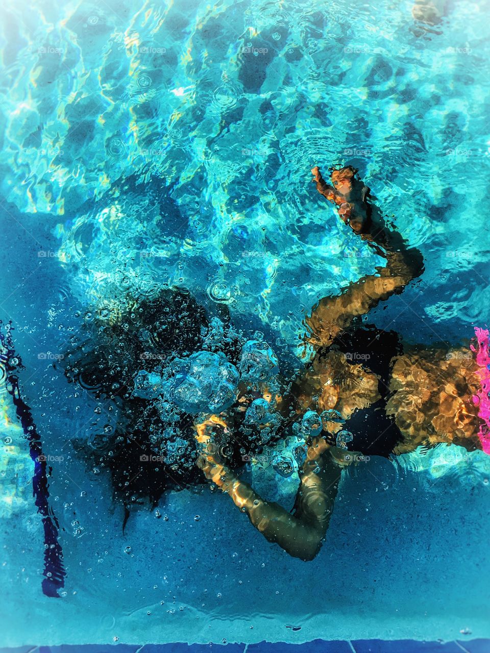Underwater girl in swimming pool