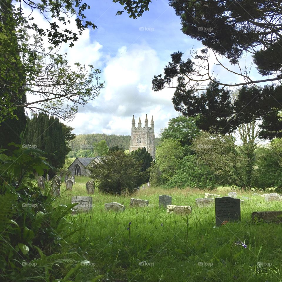 In a country churchyard. 