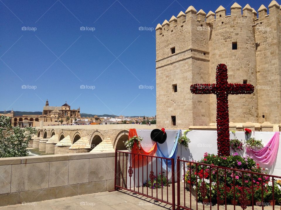 Córdoba Bridge with Cross. A picture of a bridge in Córdoba, Spain, during the Festival of the May Crosses