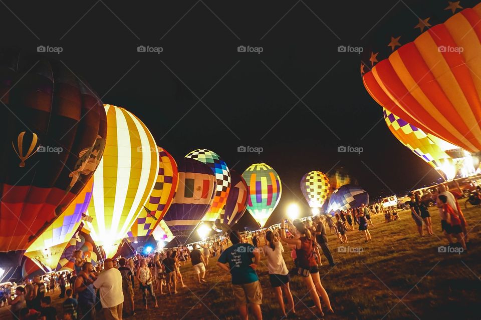 The Balloon Glow at the annual Great Texas Balloon Race, a field of hot air balloons lit up at night