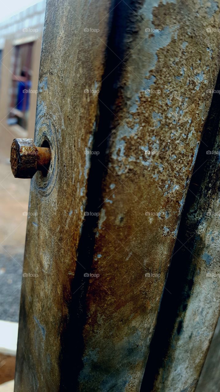 Rusty bolt of steel shed.