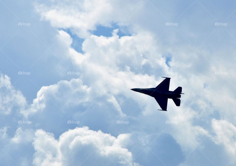 A jet flying through clouds 