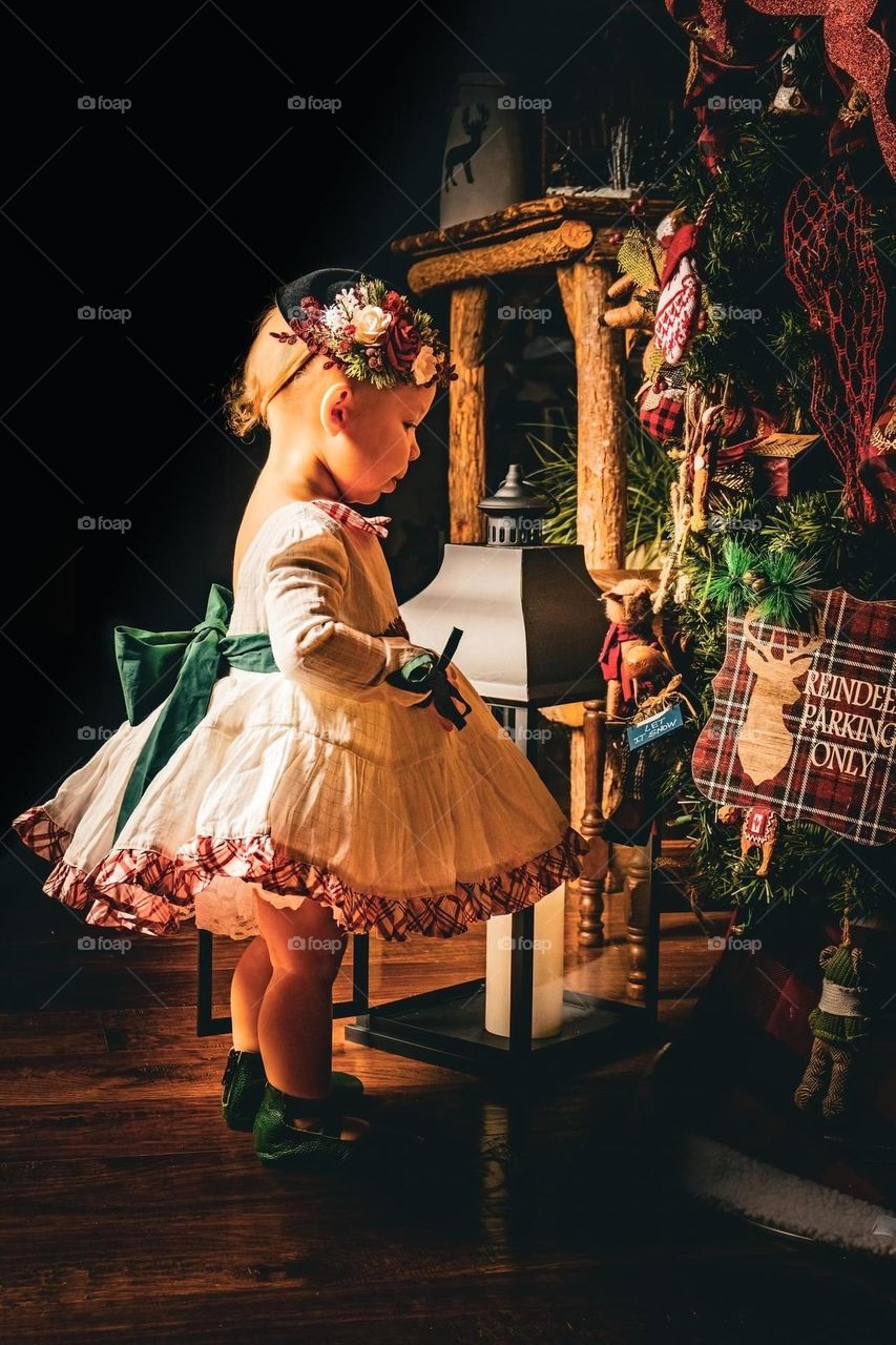 Child in front of Christmas Tree