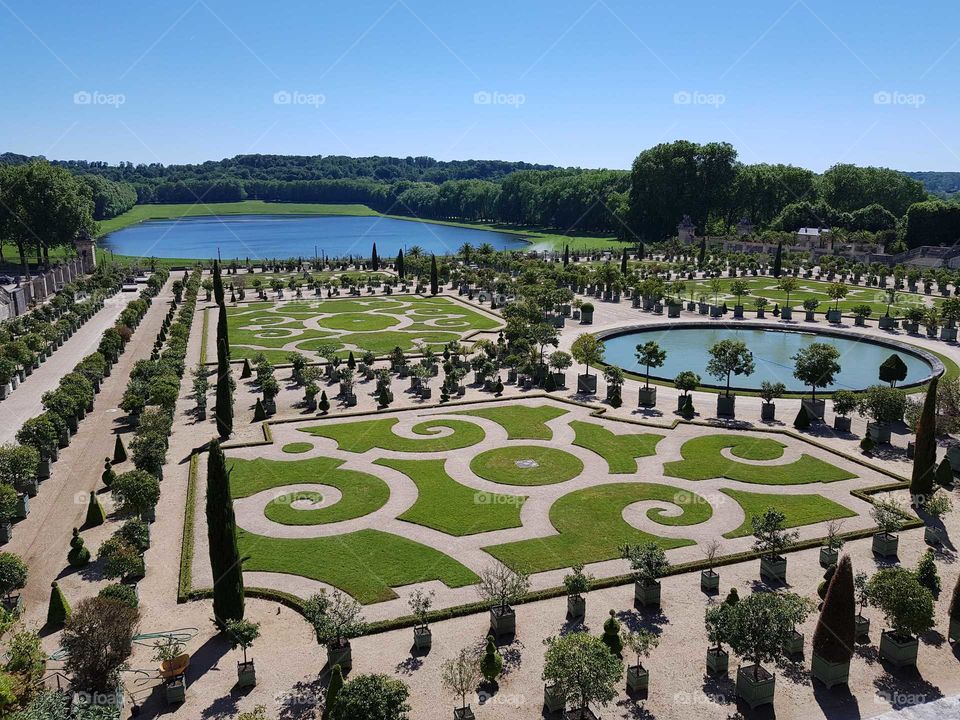 versaille palace well manicured and beautiful gardens typical of french Royal estate