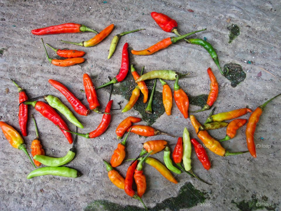 Red and green cayenne pepper in bird's eye view