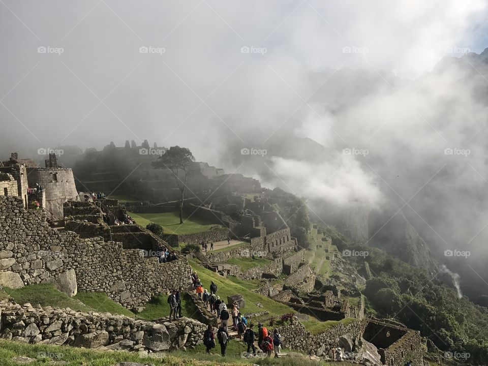 Fog begins to lift off of Machu Picchu