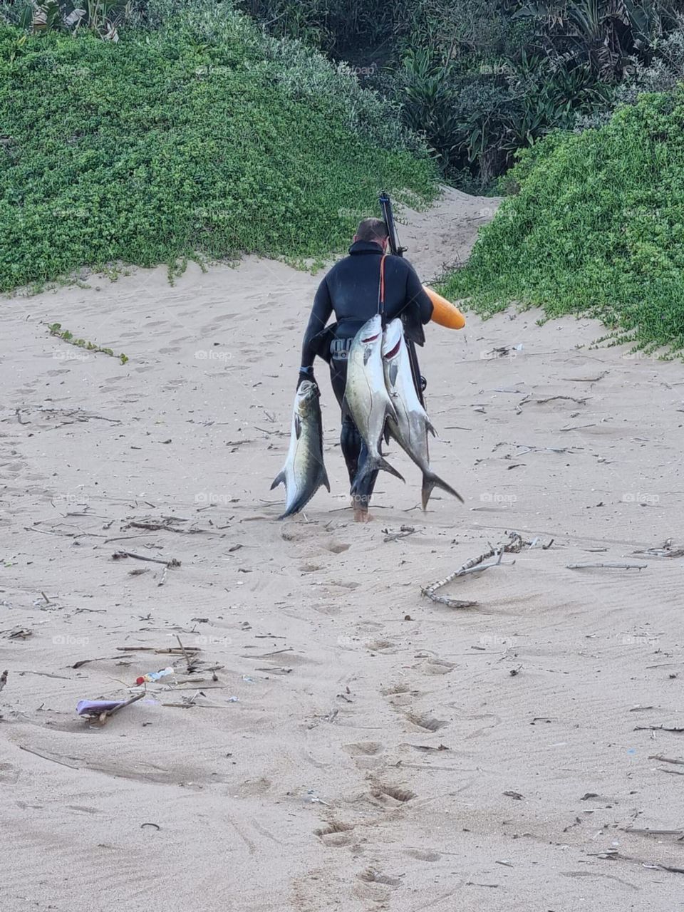 Fisherman with 3 big fish