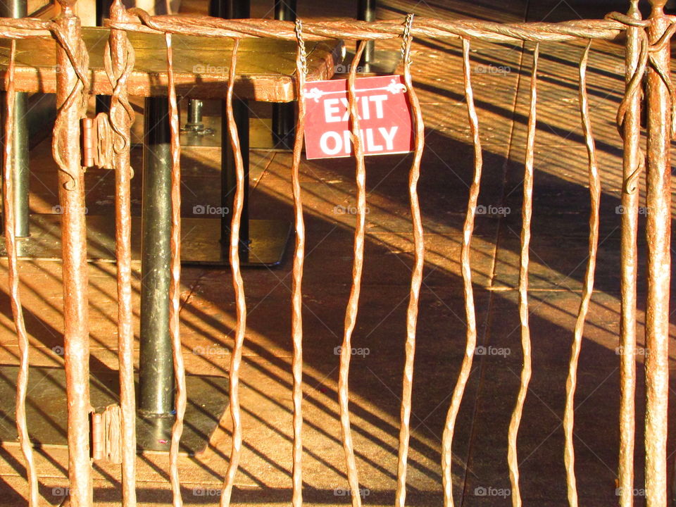 exit sign on a gate of a restaurant patio in Sacramento California