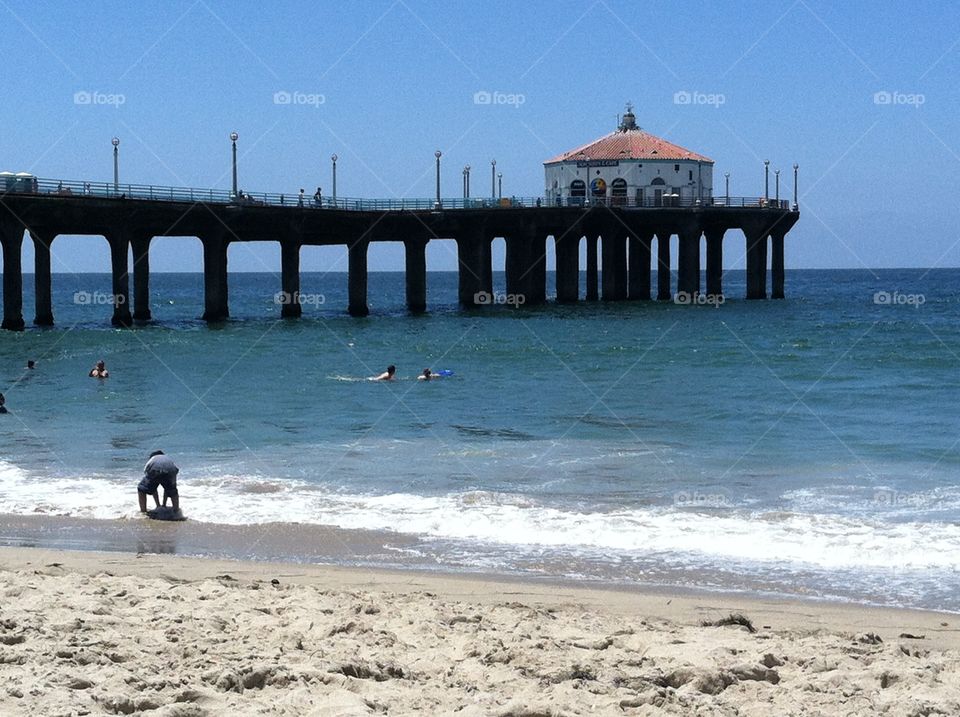 Swimming by the California pier in July