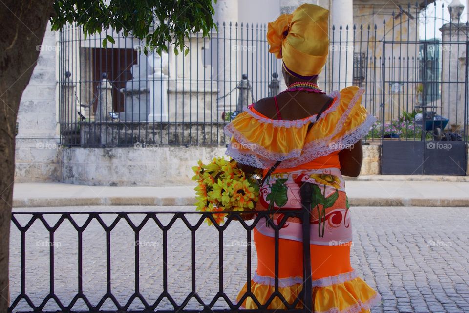 Rear view of Cuban woman in traditional clothes