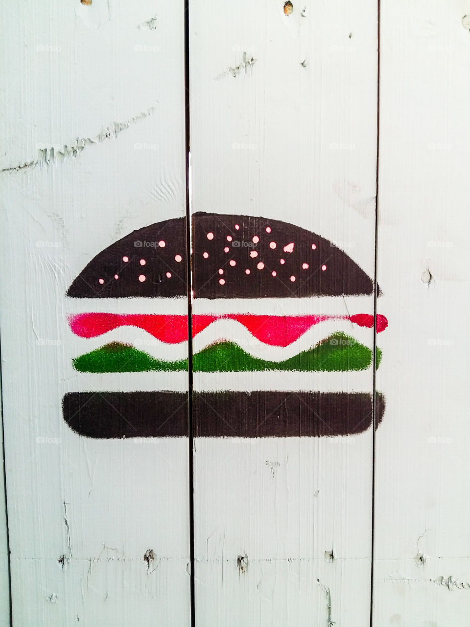 graffiti burger on white wooden boards