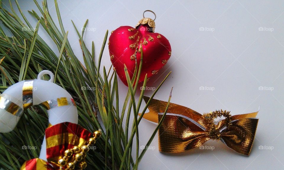 Christmas balls and pine branches on a white background