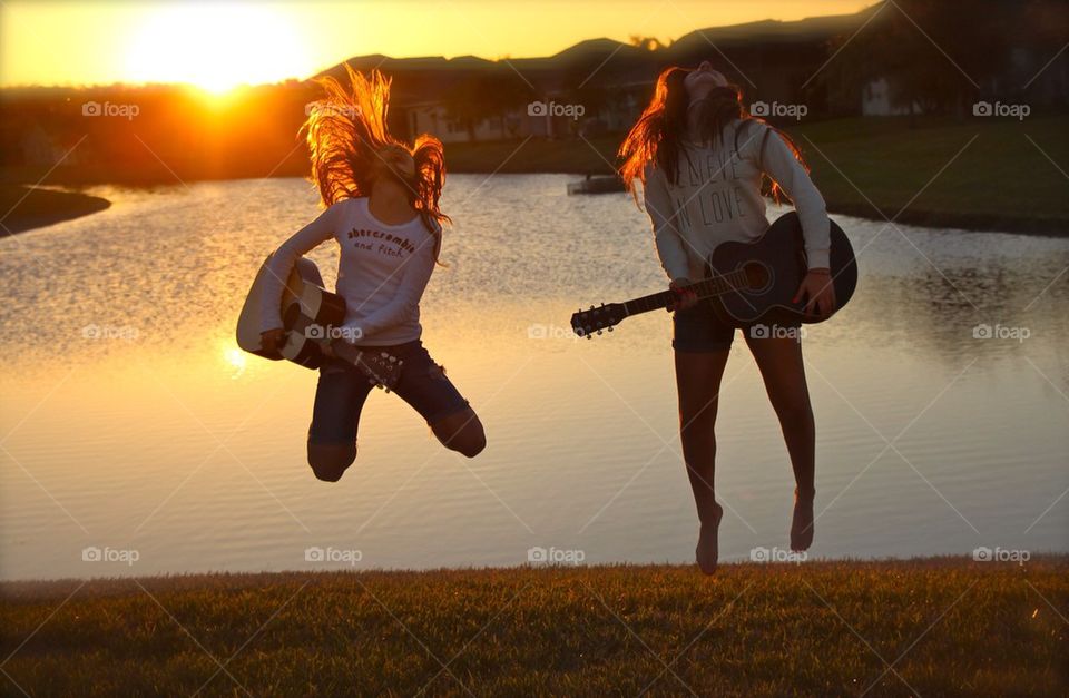 Teenage air guitar, in the back lake