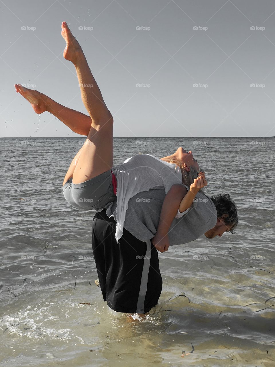 Man giving piggyback to stylish woman