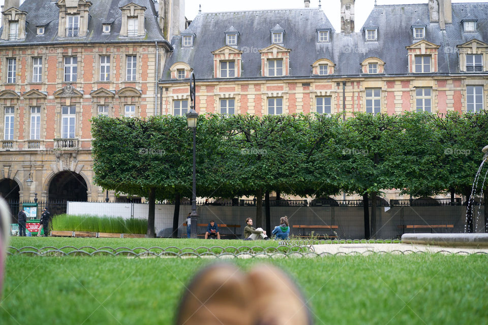 Lying on the grass in Paris