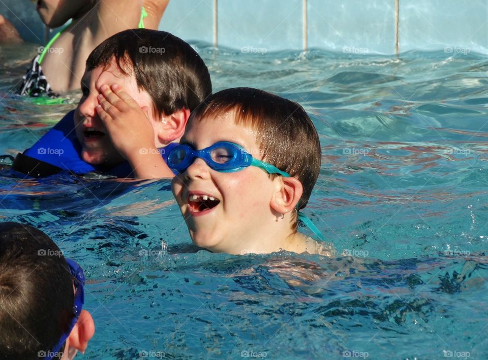 Young Swimmers. Young Boys In A Swimming Pool
