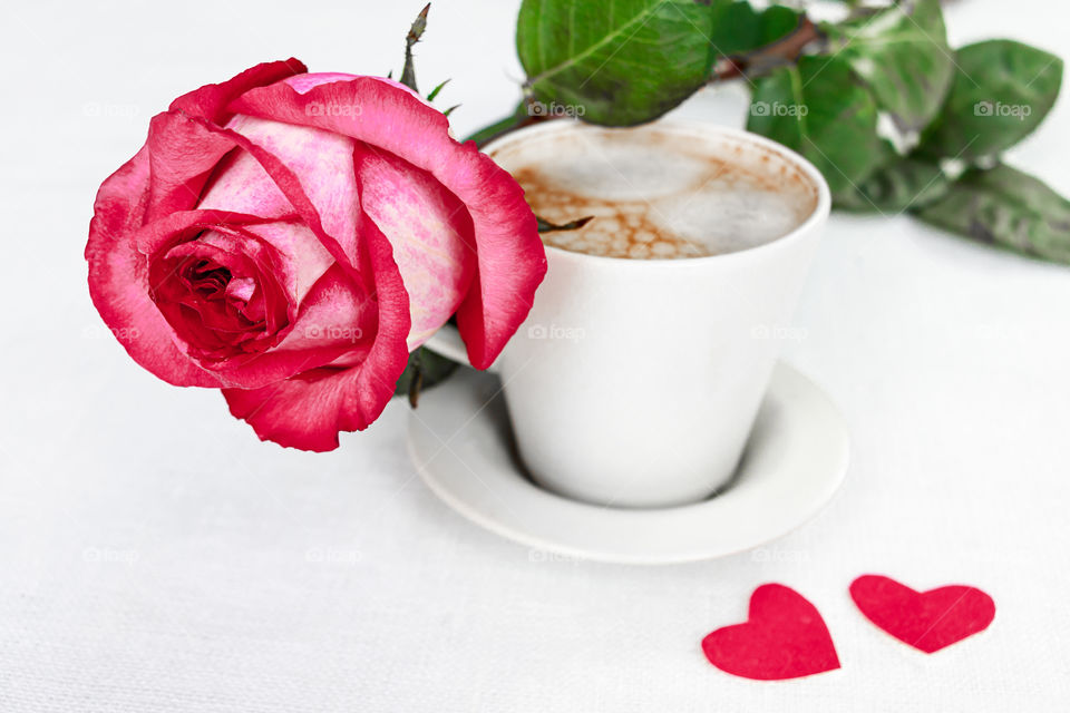 rose and cup of coffee