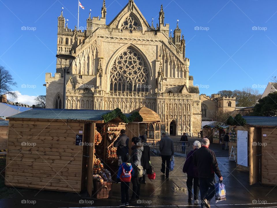 Exeter’s Cathedral green in late autumn sunshine with a back drop of Exeter Cathedral, and a Christmas market in full swing.