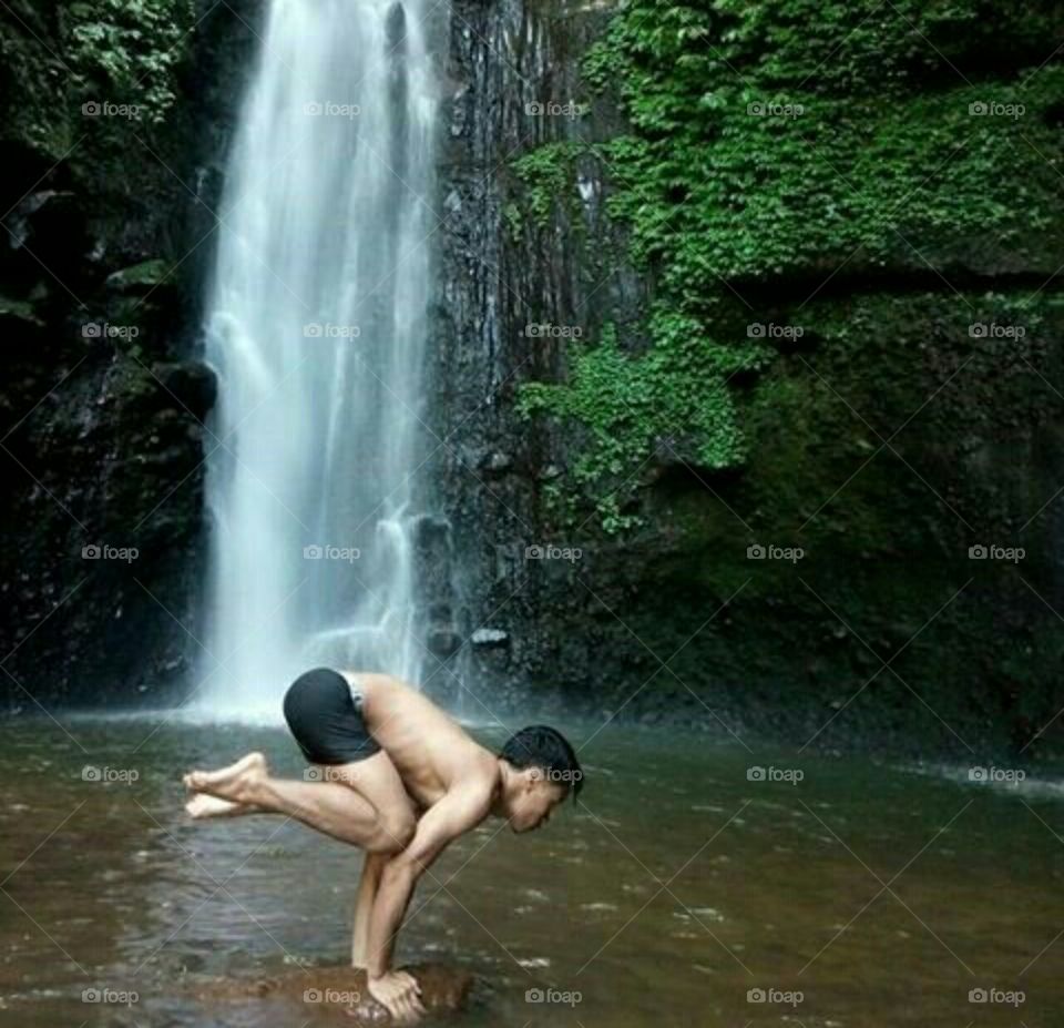 practice yoga at waterfall