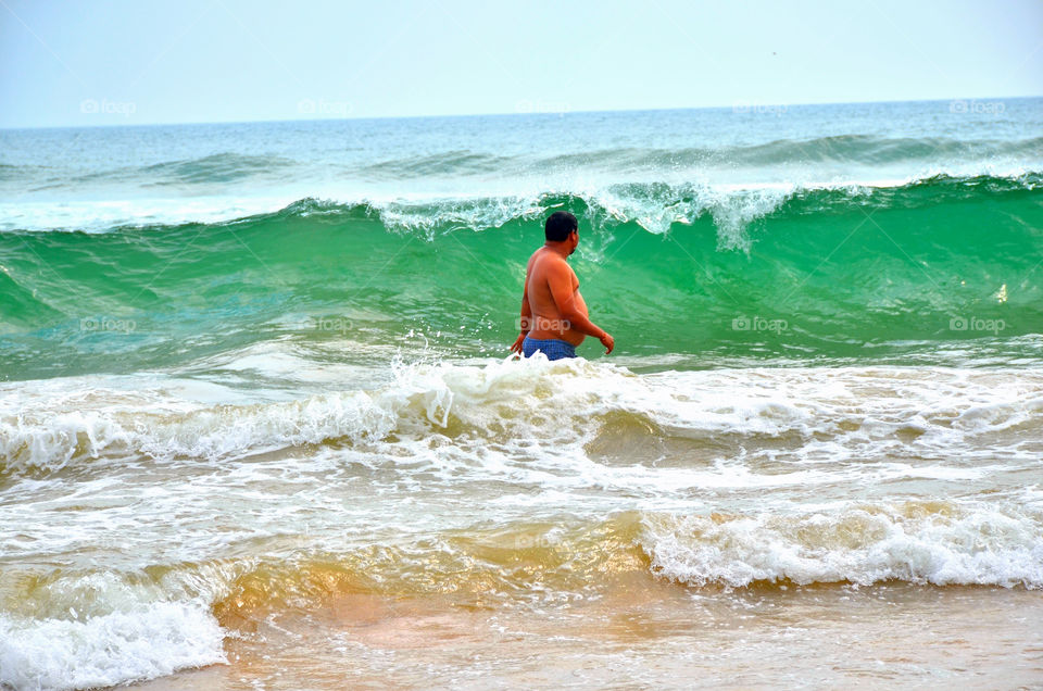 boy enjoying sea beach