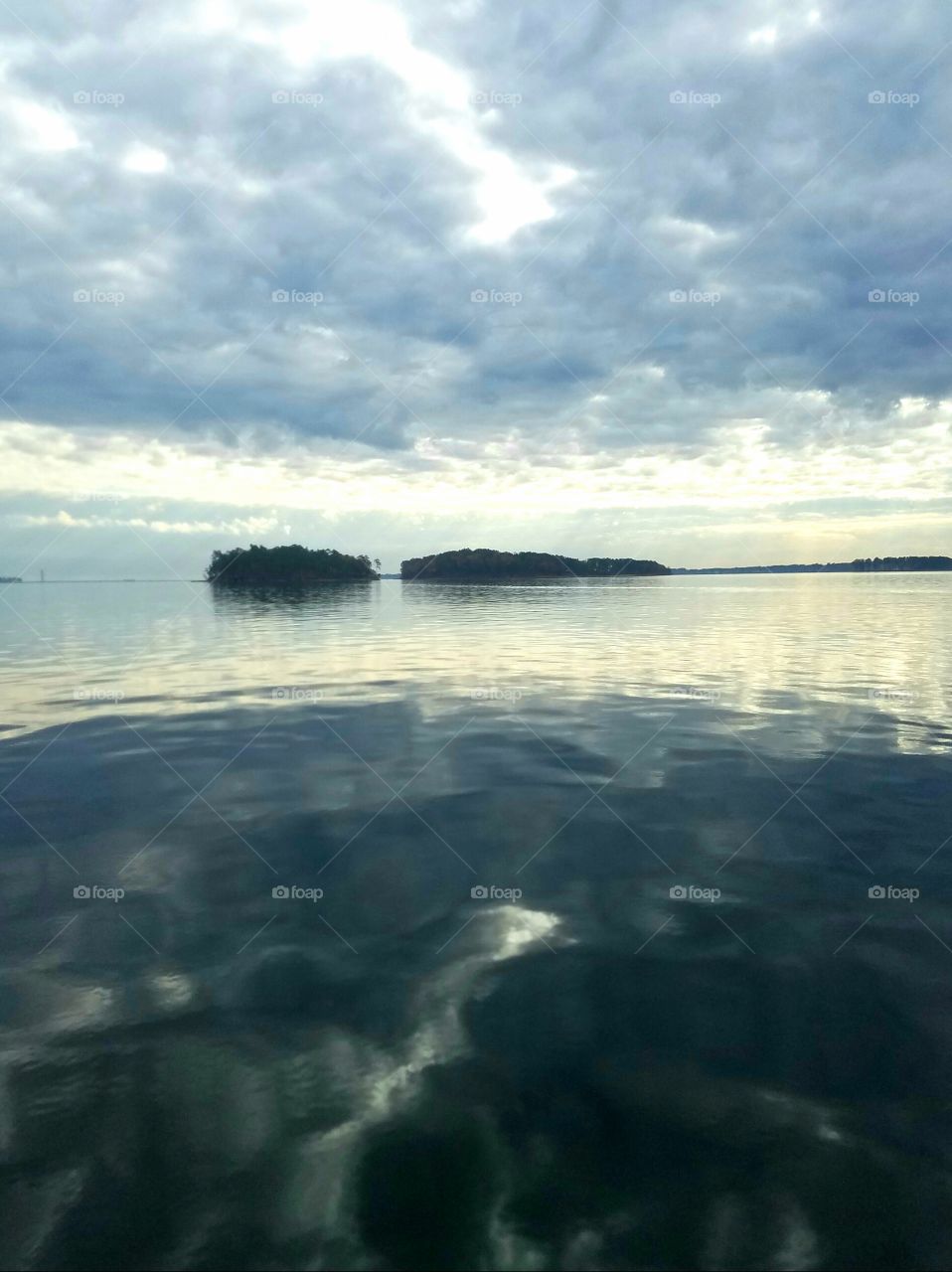 reflections of clouds on lake