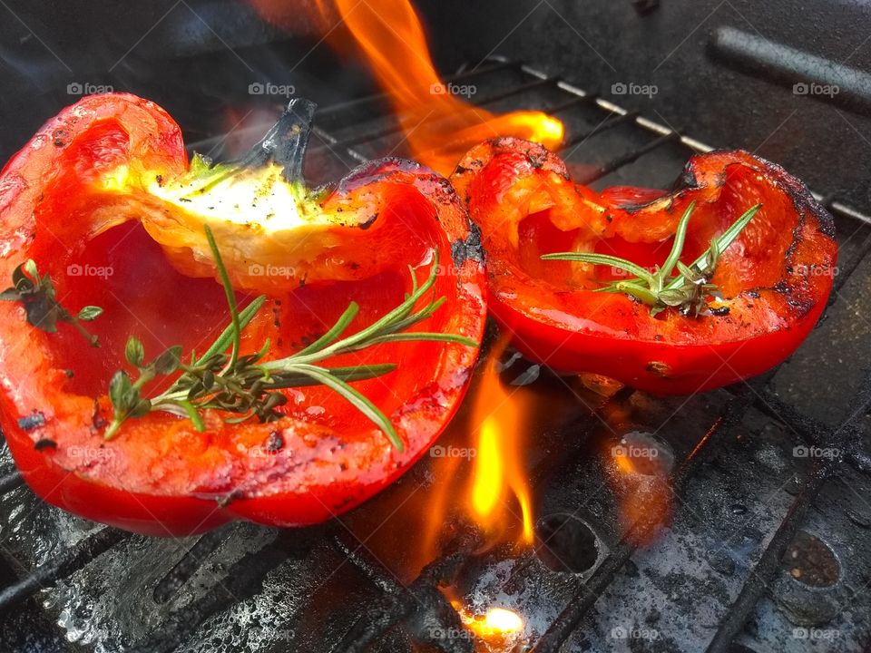 Red bell pepper preparing on barbecue