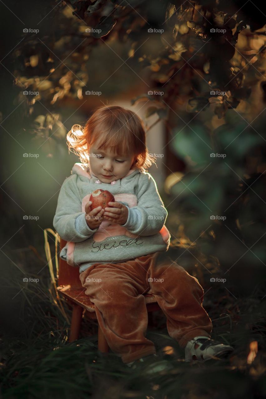 Little girl portrait with apple