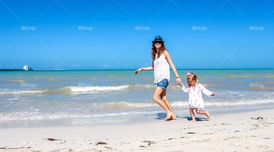 Mom child fun at the beach