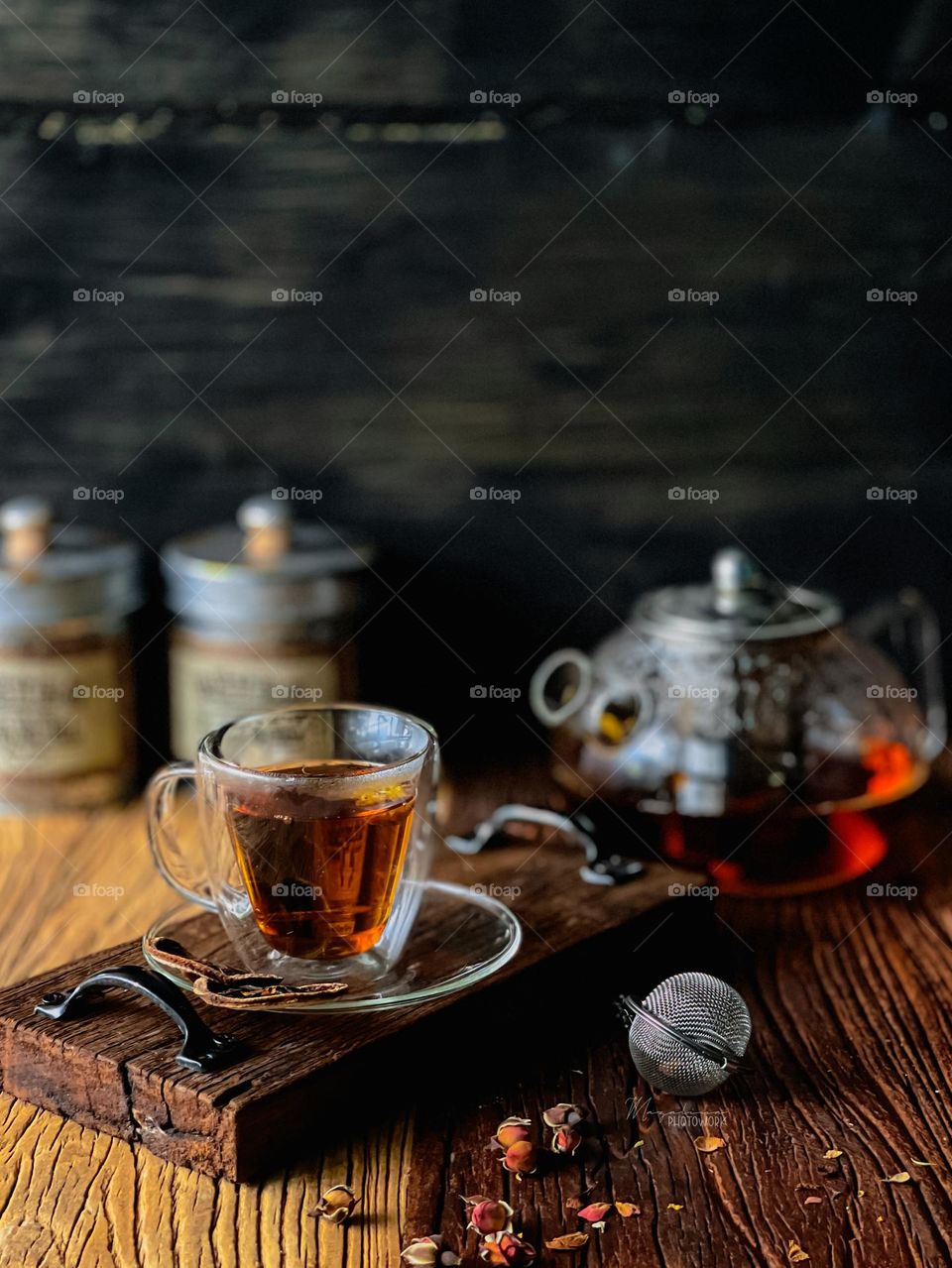 A cup of hot tea on a wooden board with vintage mood. For tea lover