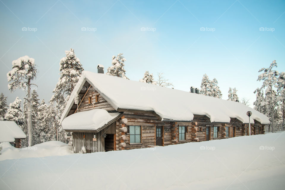 Snow covered house in a frosty mountains country