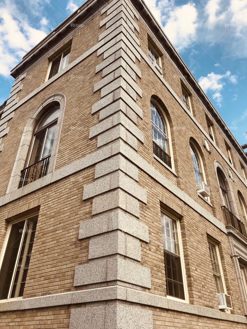 Amazing corner showing fun rectangular shaped blocks with beautiful blue sky above! 